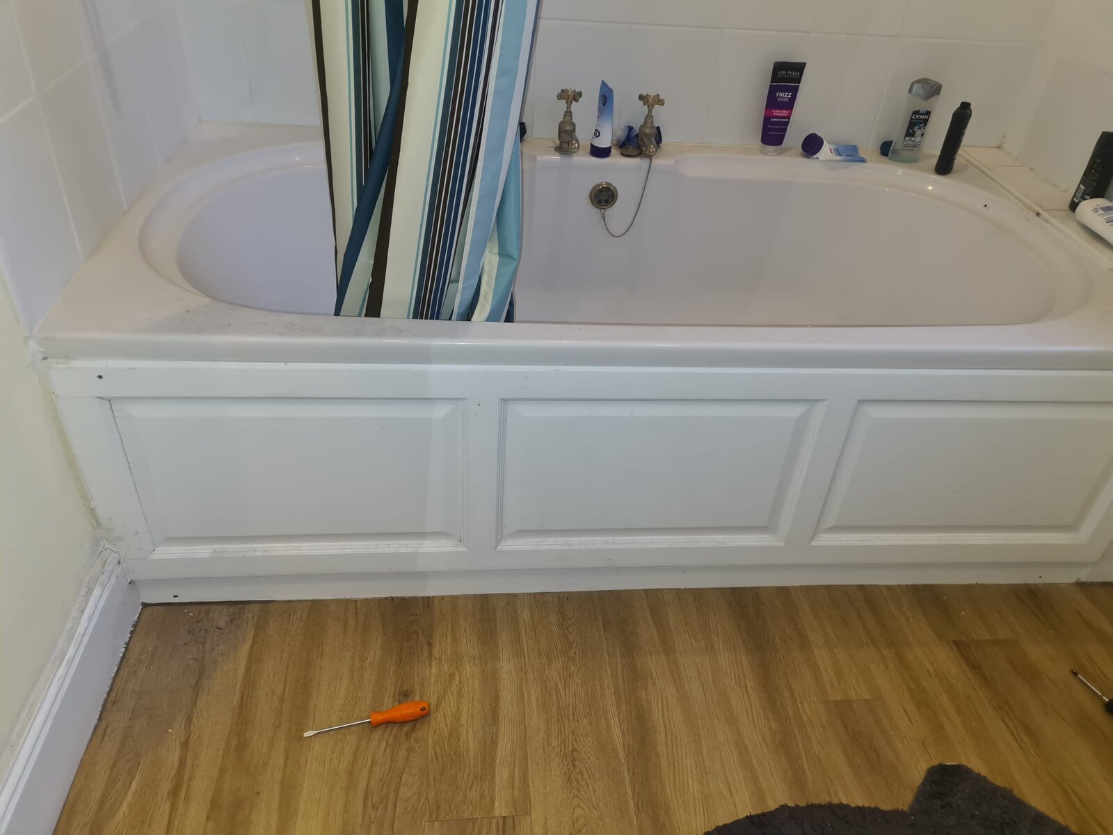 Leak from bath! water dipping to kitchen, how to remove bath side wood