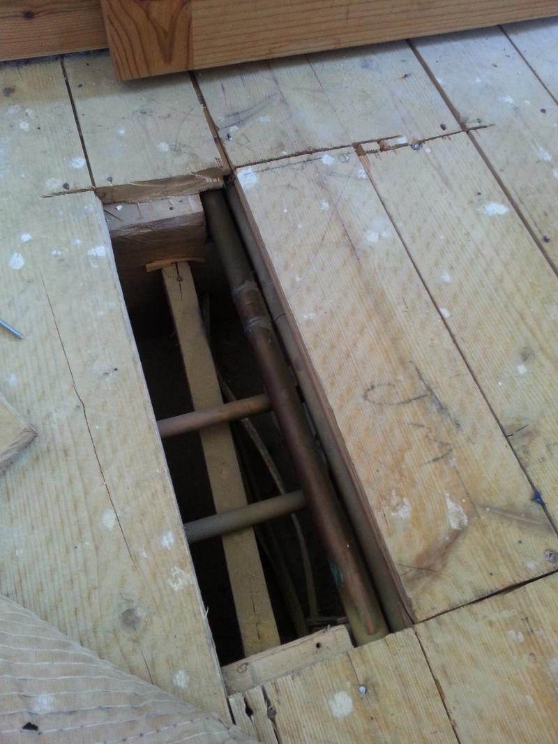 Floorboard resting on pipes DIYnot Forums