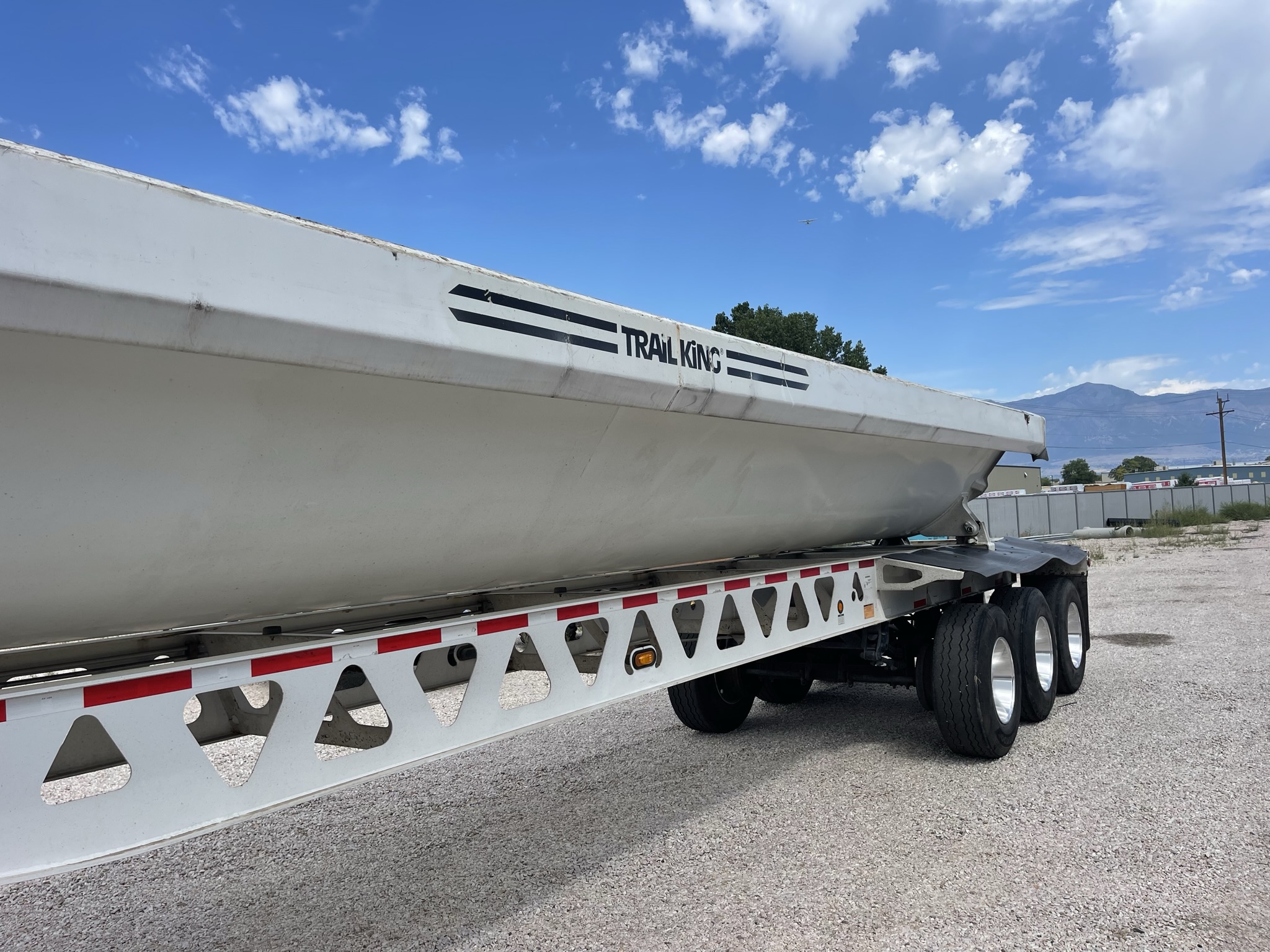 TK60SSD433 TRIPLE AXLE SIDE DUMP TRAILER Dogface Heavy Equipment