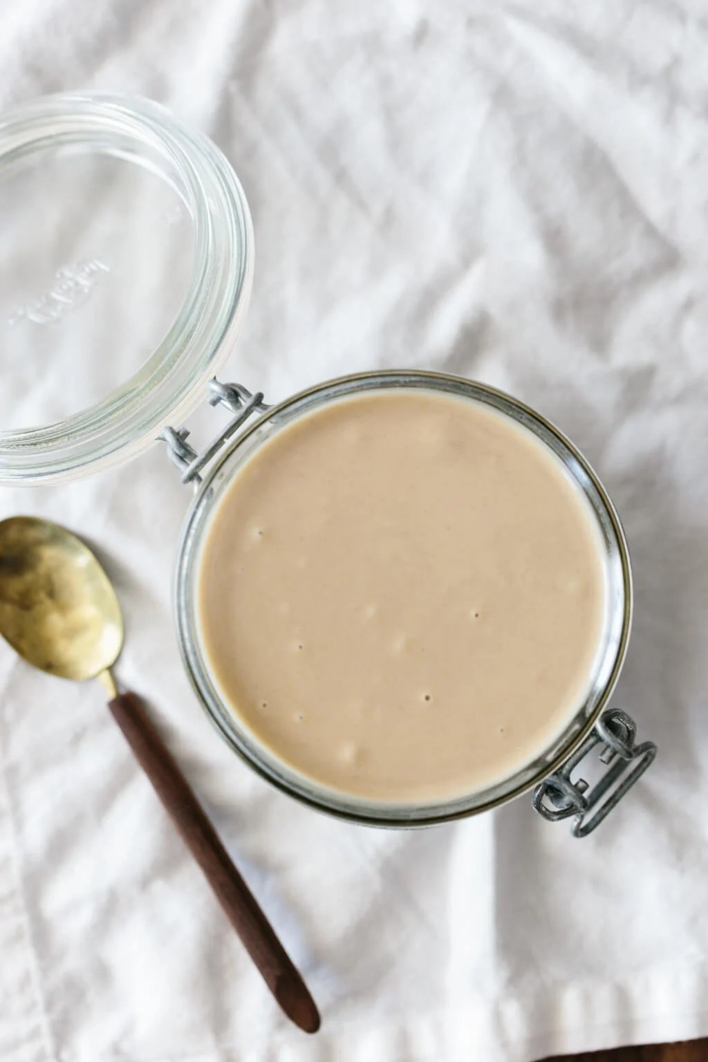 Tahini is super easy to make at home and cheaper than buying in the store. But I have a few tips for the creamiest, best tahini recipe. #Tahini #TahiniRecipe #SesameSeeds #Vegan #HealthyRecipes