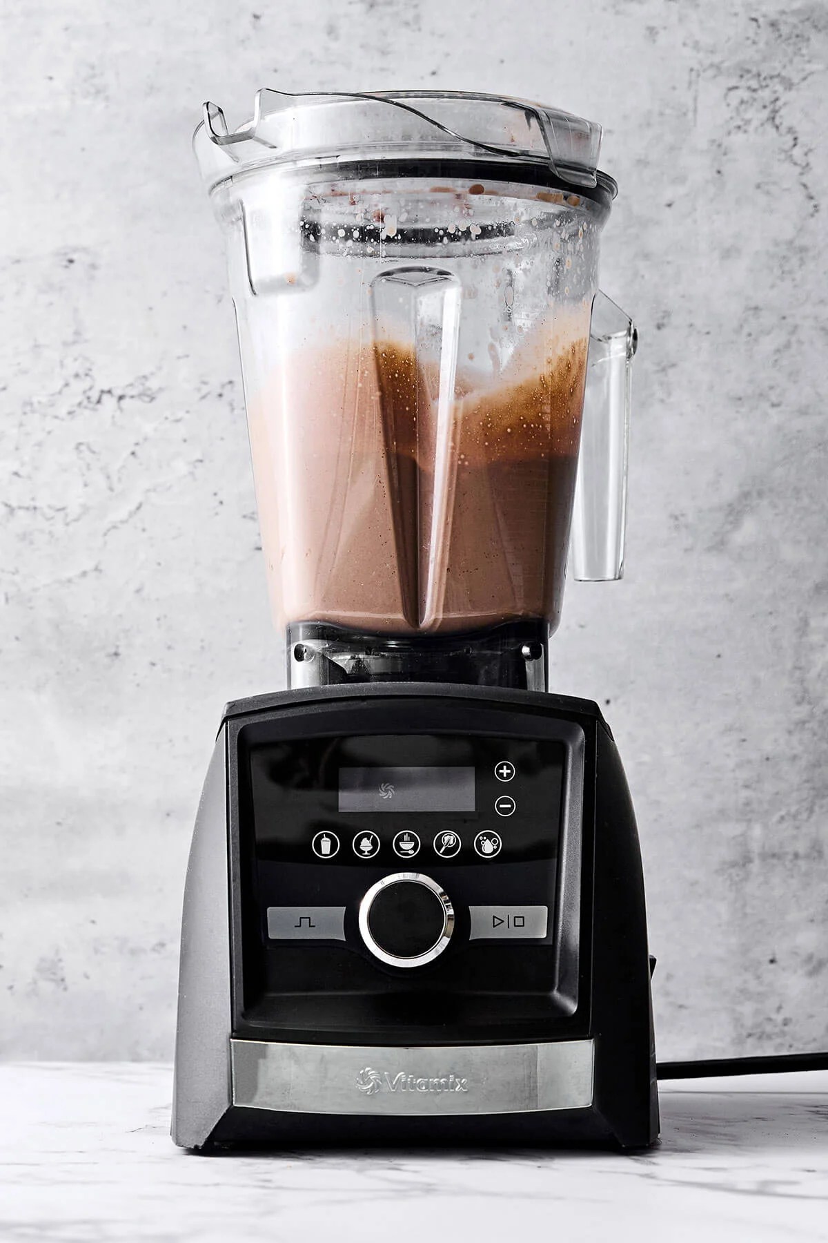 Blending chocolate collagen smoothie.
