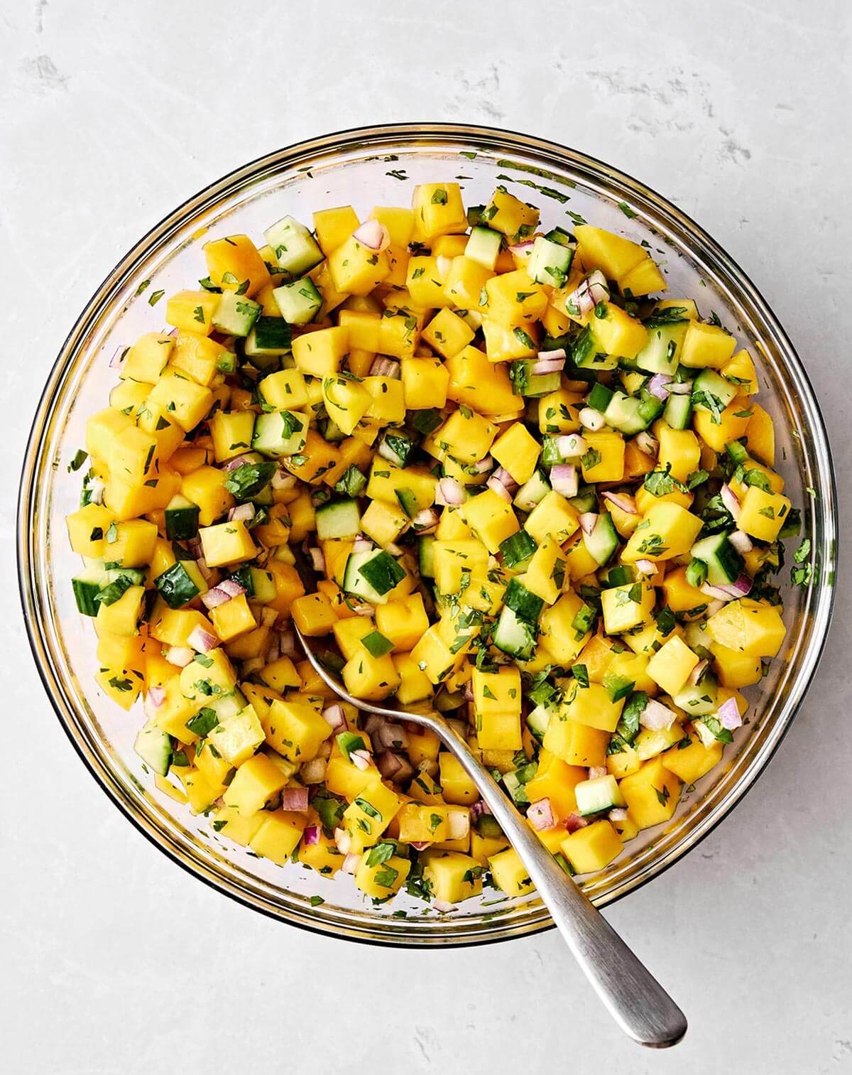 Mixed mango salsa in a bowl.