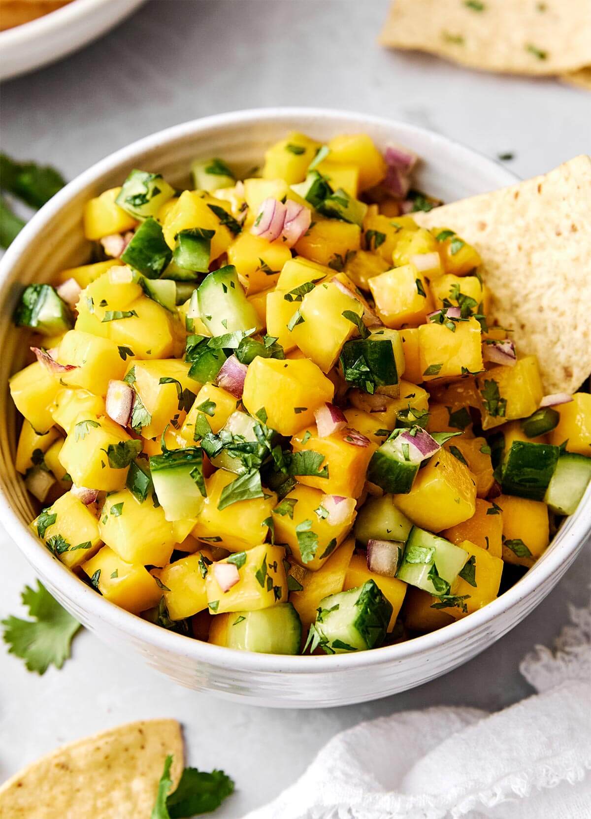 A bowl of mango salsa.