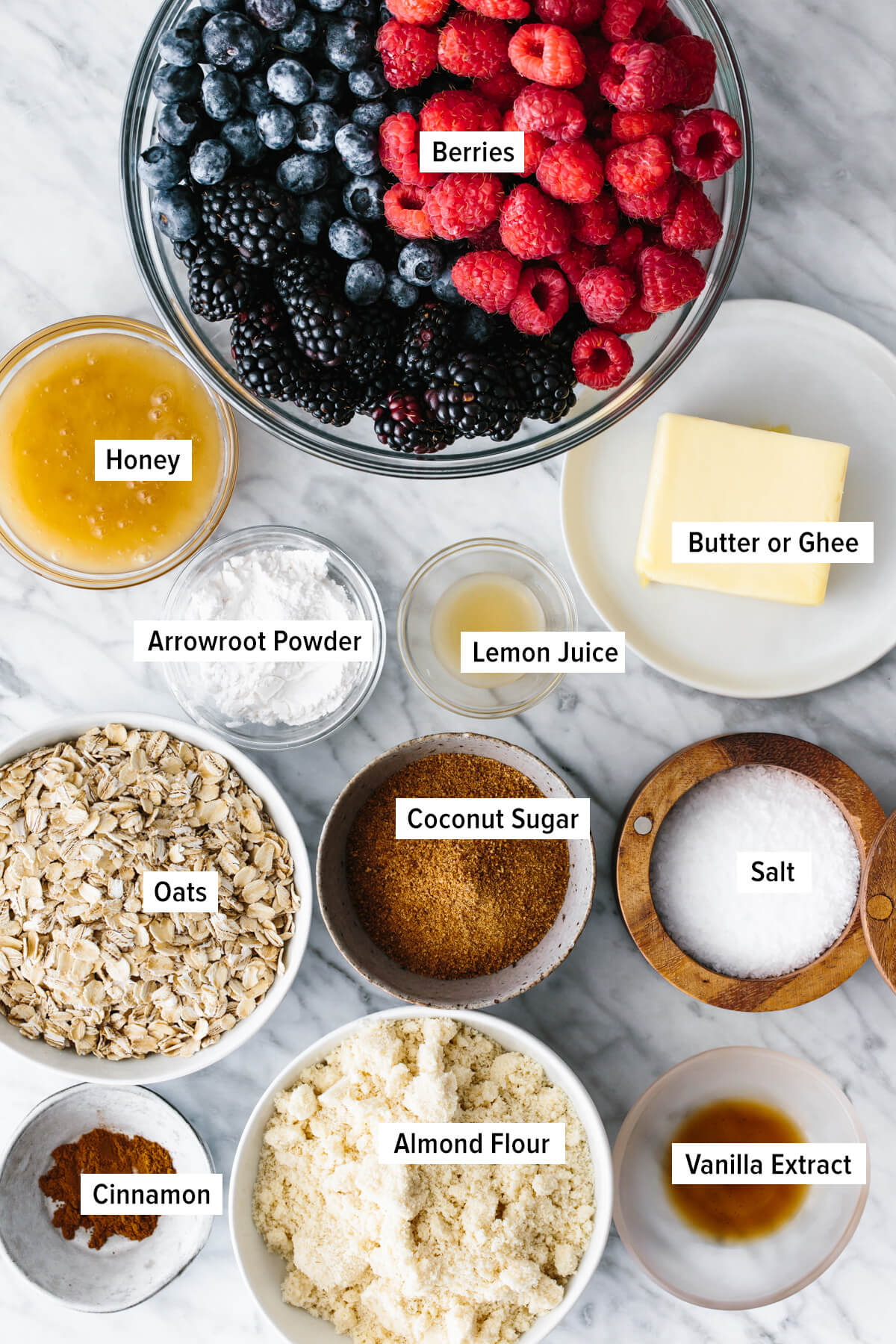 The ingredients for making berry crisp on a table.