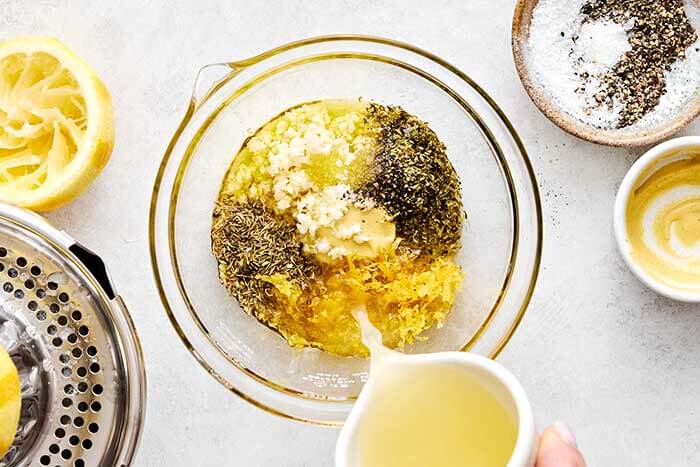 Making lemon Dijon marinade for chicken.