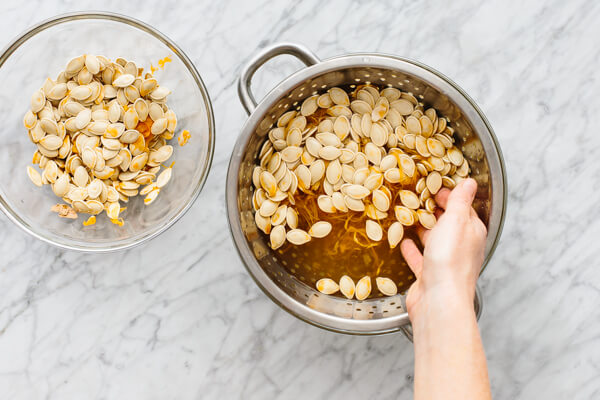 Pumpkin seeds being washed for roasting