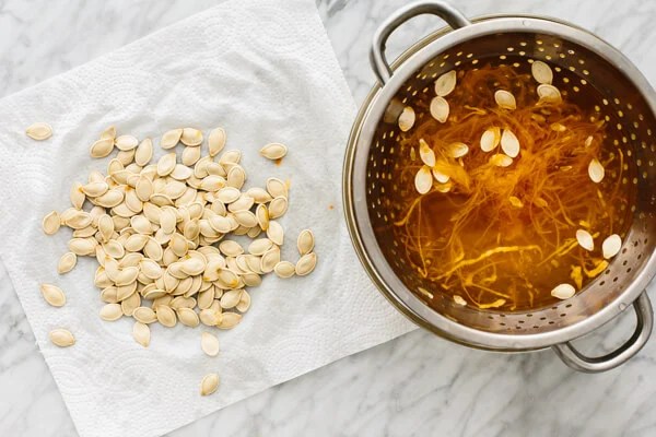 Pumpkin seeds being dried before roasting.