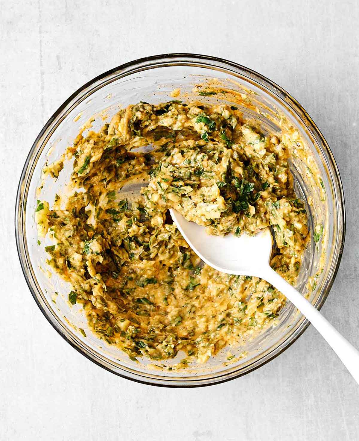 This baked cod is my foolproof recipe for flaky white fish, in under 30 minutes. A simple buttery garlic herb topping is all you need! Step two of baked cod: mix the her butter mixture.