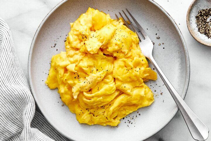 Scrambled eggs on a plate.