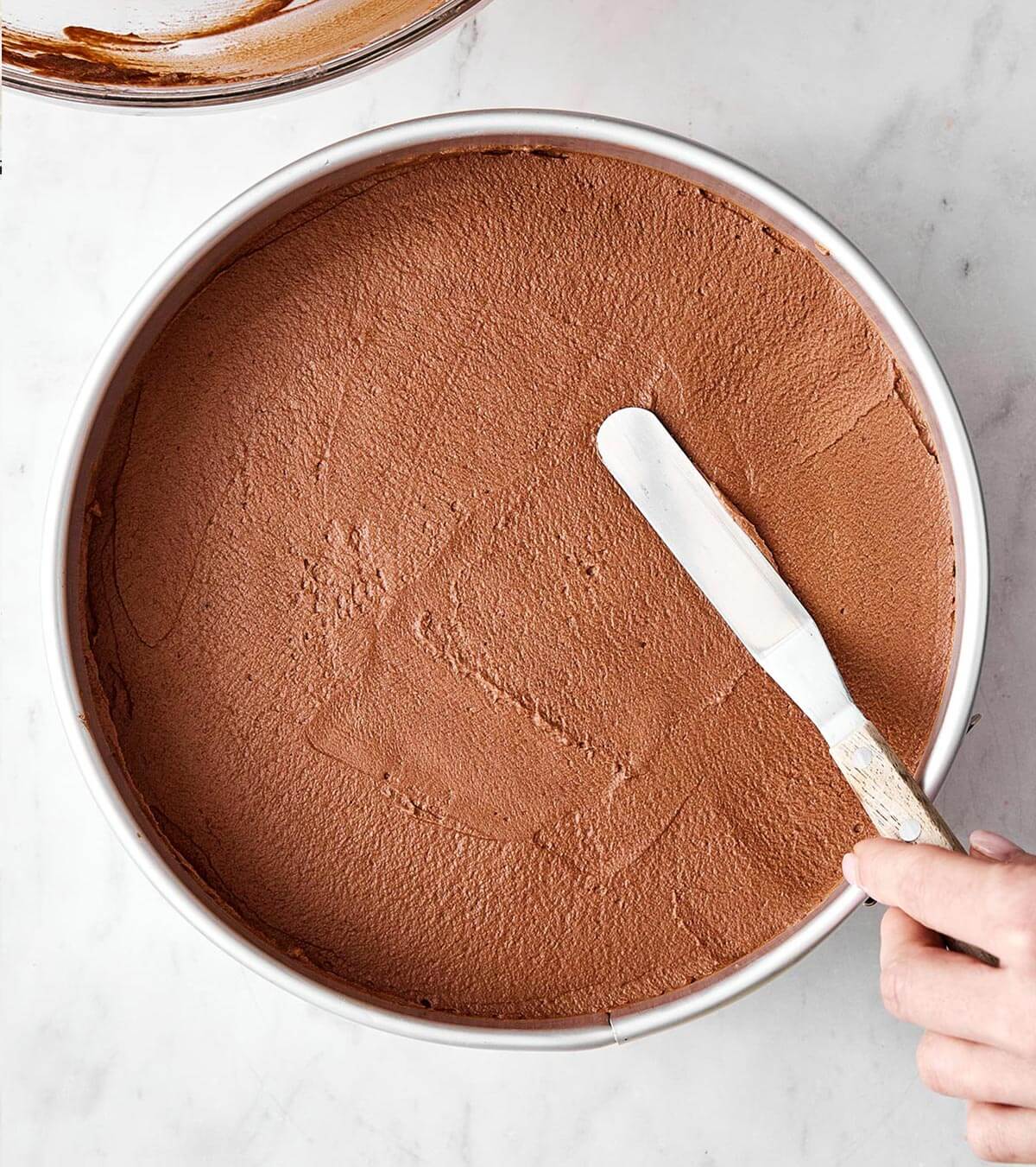 Making chocolate mousse cake.