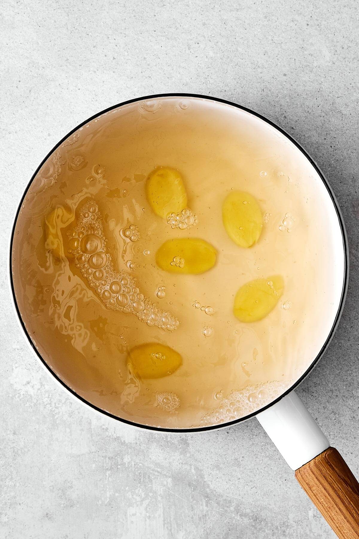 Boiled ginger and water in a pot.