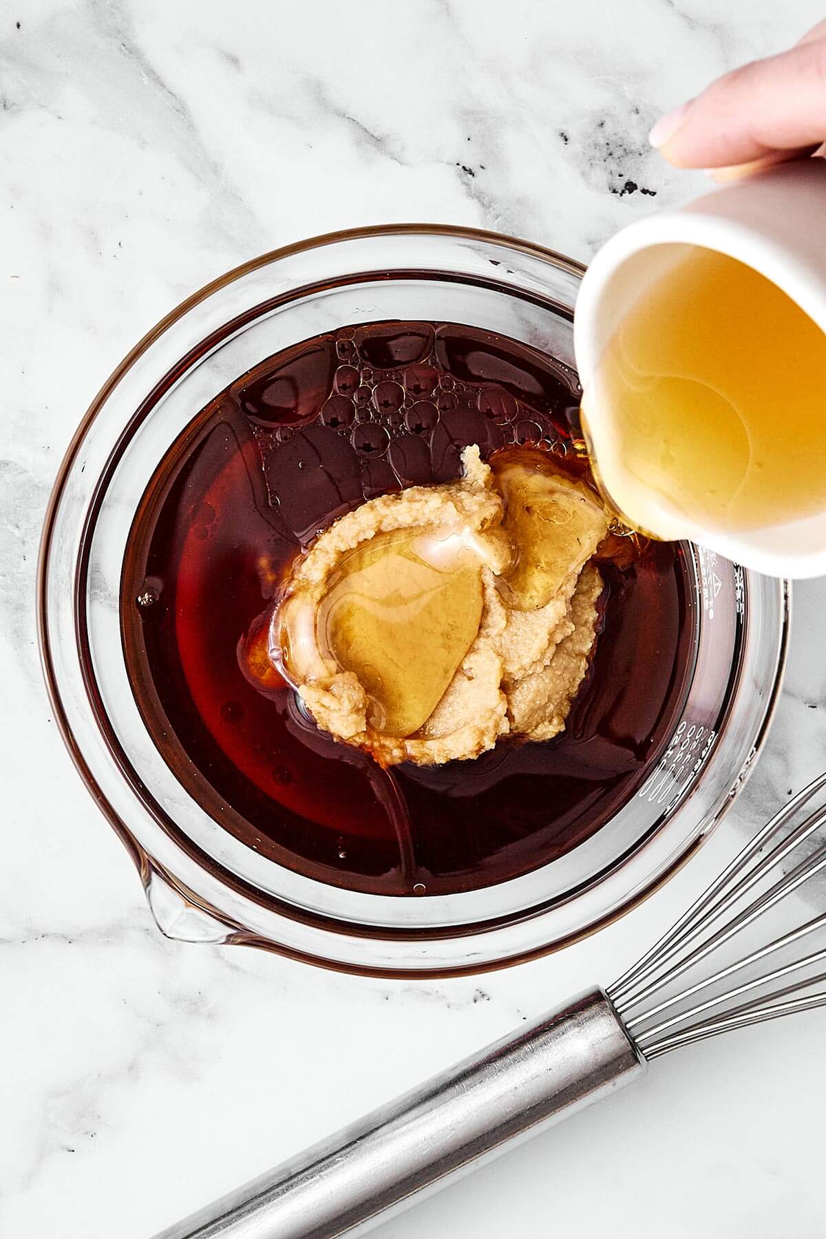 Mixing miso glaze in a bowl.