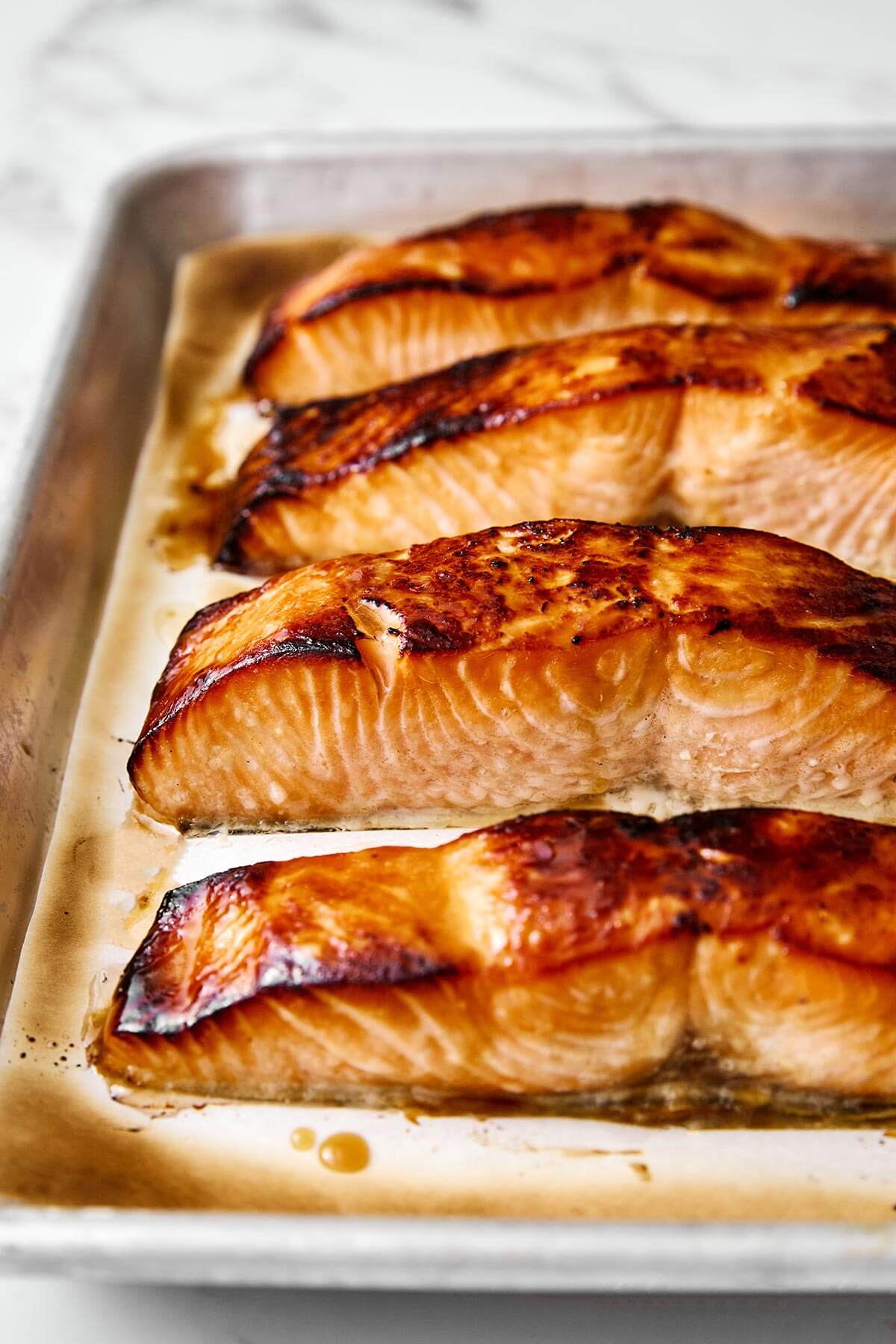 A sheet pan of miso salmon filets.