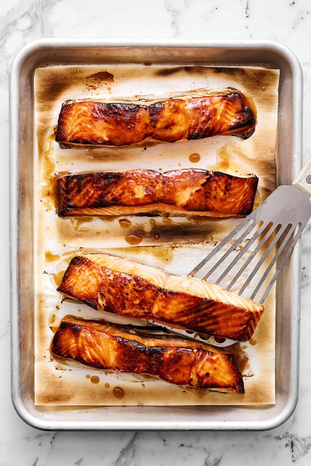Broiled miso salmon on a sheet pan.