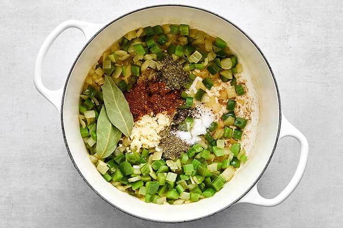 Step three of red beans and rice: add aromatics and veggies.