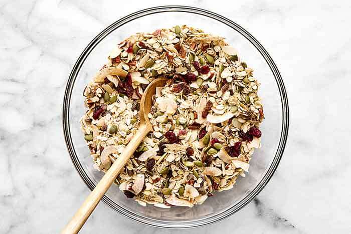 Mixing muesli in a bowl.