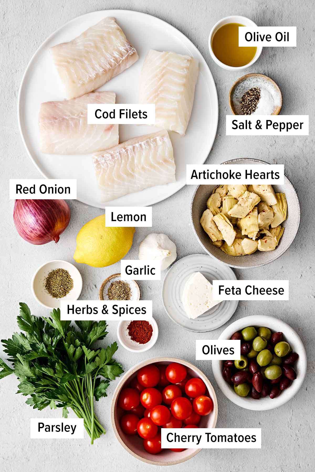 This Greek baked cod is the perfect all-in-one Mediterranean dinner! It's healthy, easy, and delicious! Greek baked cod with vegetables in a casserole pan.