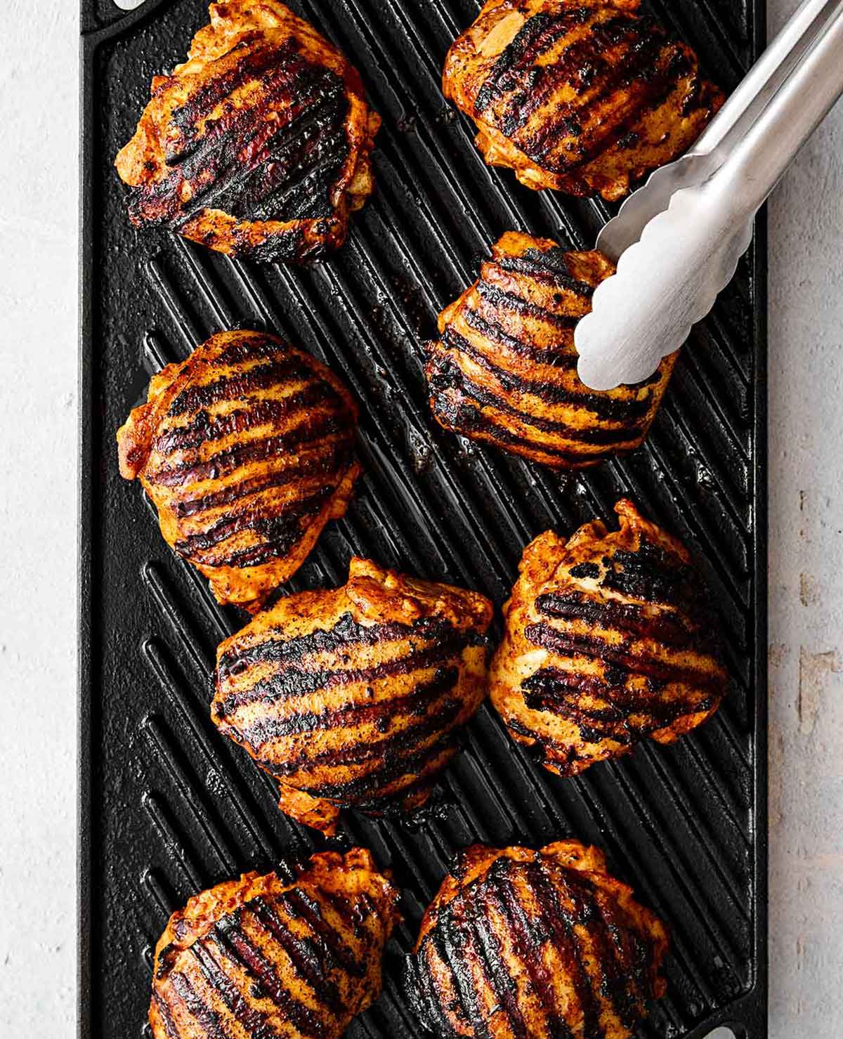With a bold citrus marinade and smoky char, this grilled pollo asado (chicken) is the best grilling recipe for Mexican dinner nights! Grilling pollo asado.