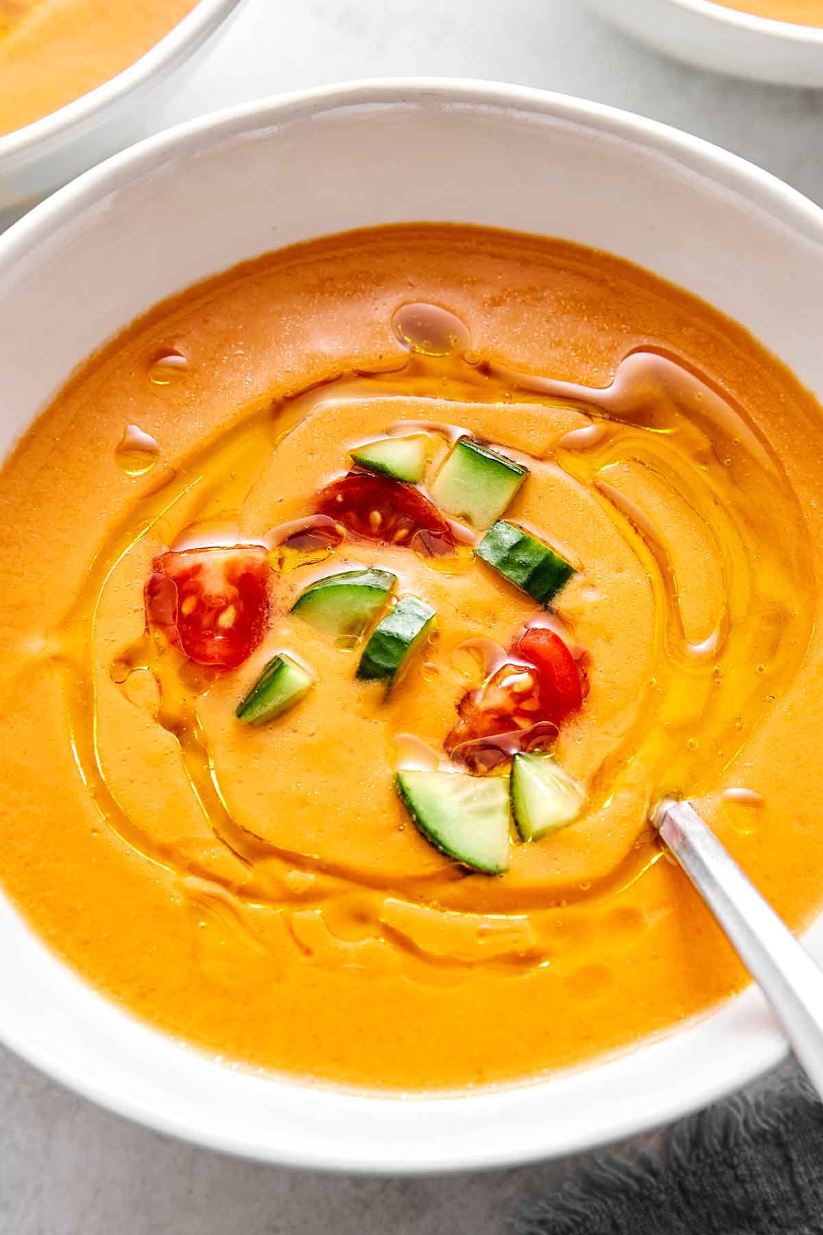This red gazpacho is the ideal summer soup! It's chilled, creamy, and a great way to make the most of sweet, in-season tomatoes. Classic Spanish gazpacho in a bowl.