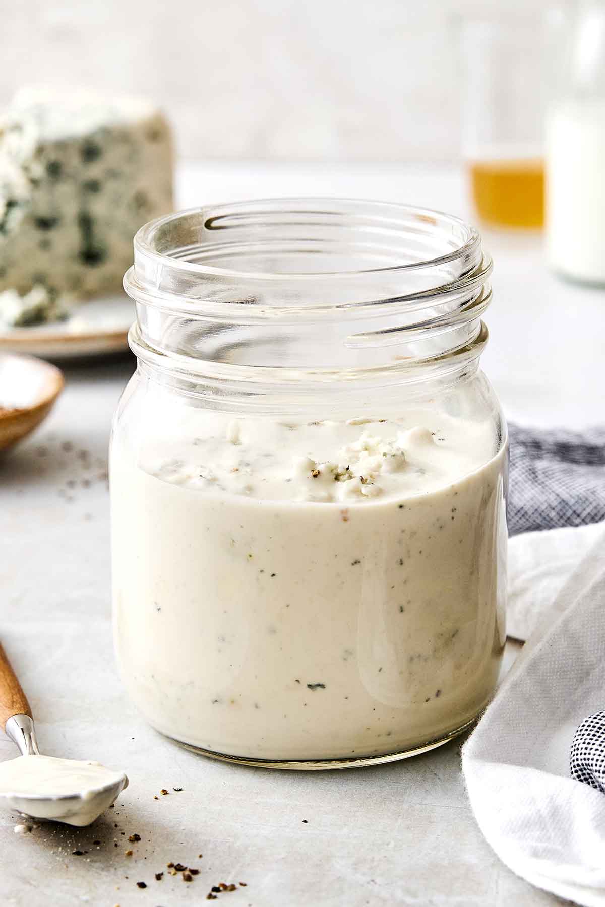 This blue cheese dressing is rich, creamy, tangy, and gives that classic steakhouse flavor perfect for a classic wedge salad. Blue cheese dressing in a jar.
