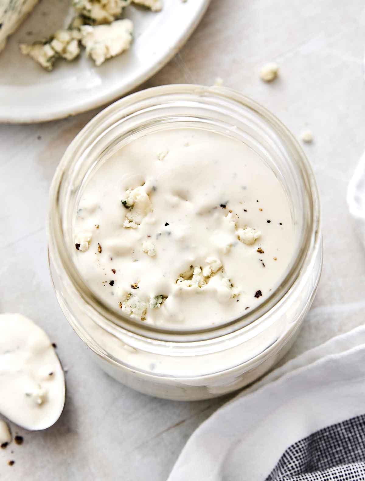 This blue cheese dressing is rich, creamy, tangy, and gives that classic steakhouse flavor perfect for a classic wedge salad. A jar of blue cheese dressing.