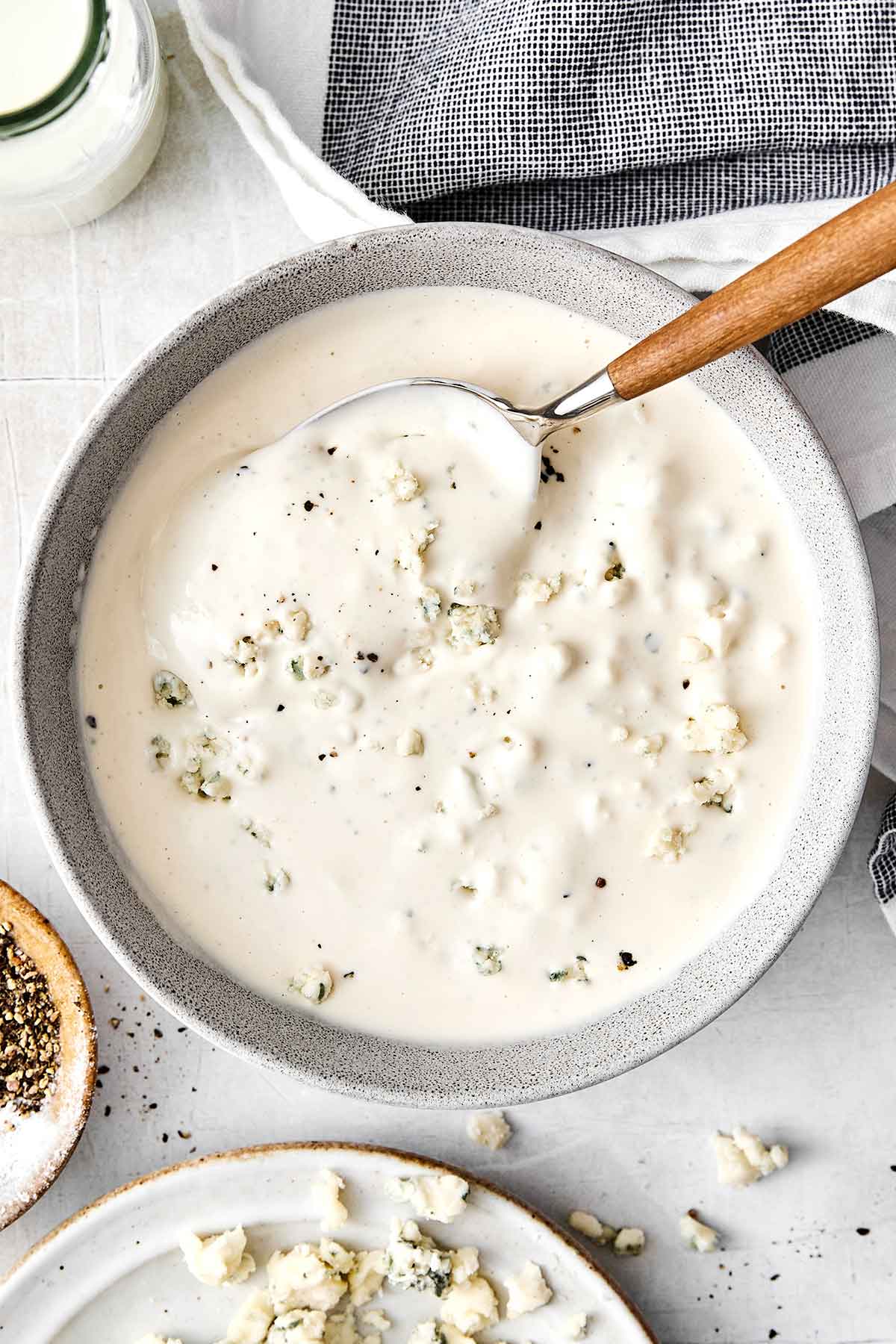 This blue cheese dressing is rich, creamy, tangy, and gives that classic steakhouse flavor perfect for a classic wedge salad. Homemade blue cheese dressing in a bowl.