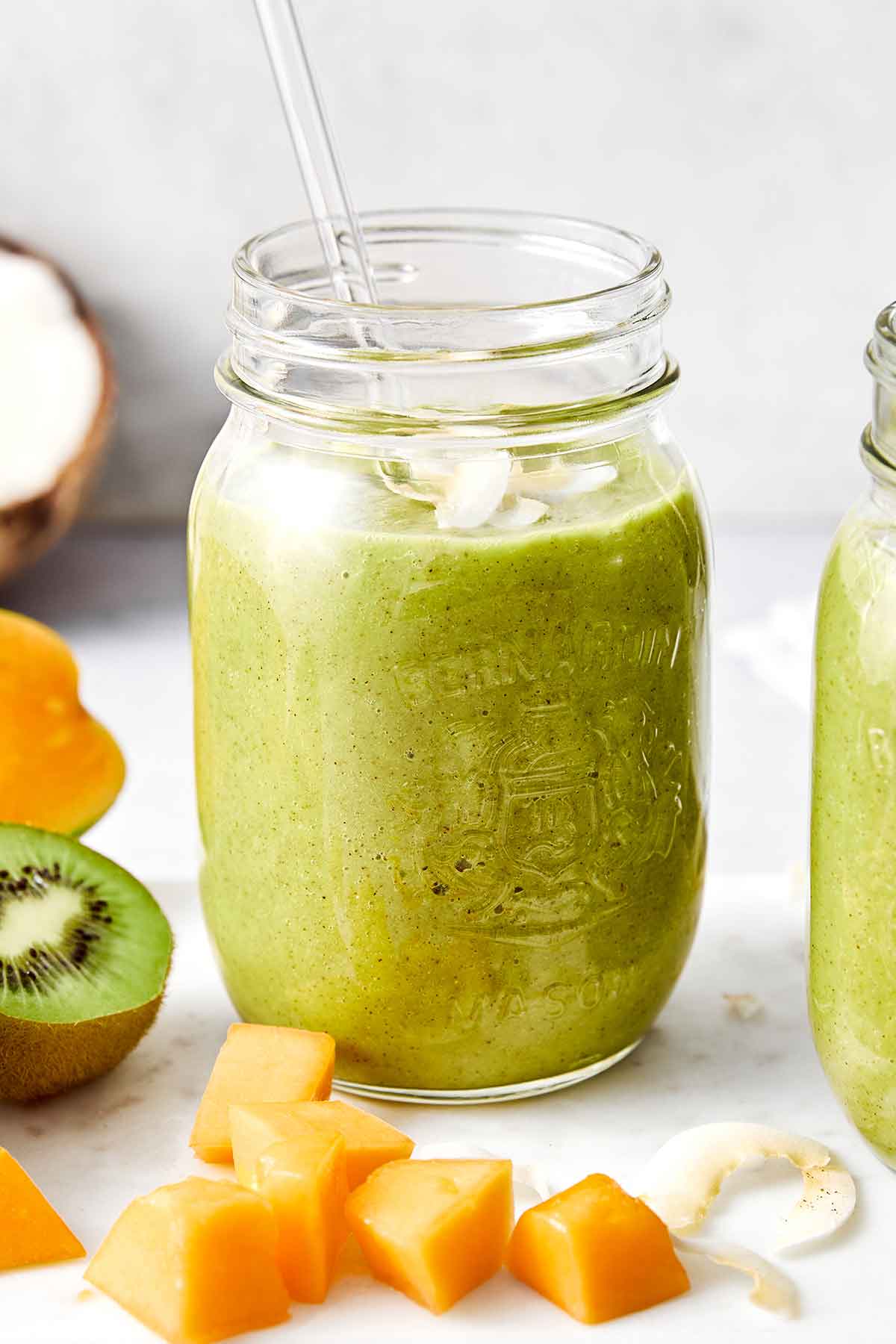 Packed with fiber-rich and hydrating ingredients, this tropical digestive smoothie is great for cleansing your gut and tastes delicious! A glass of tropical digestive smoothie.
