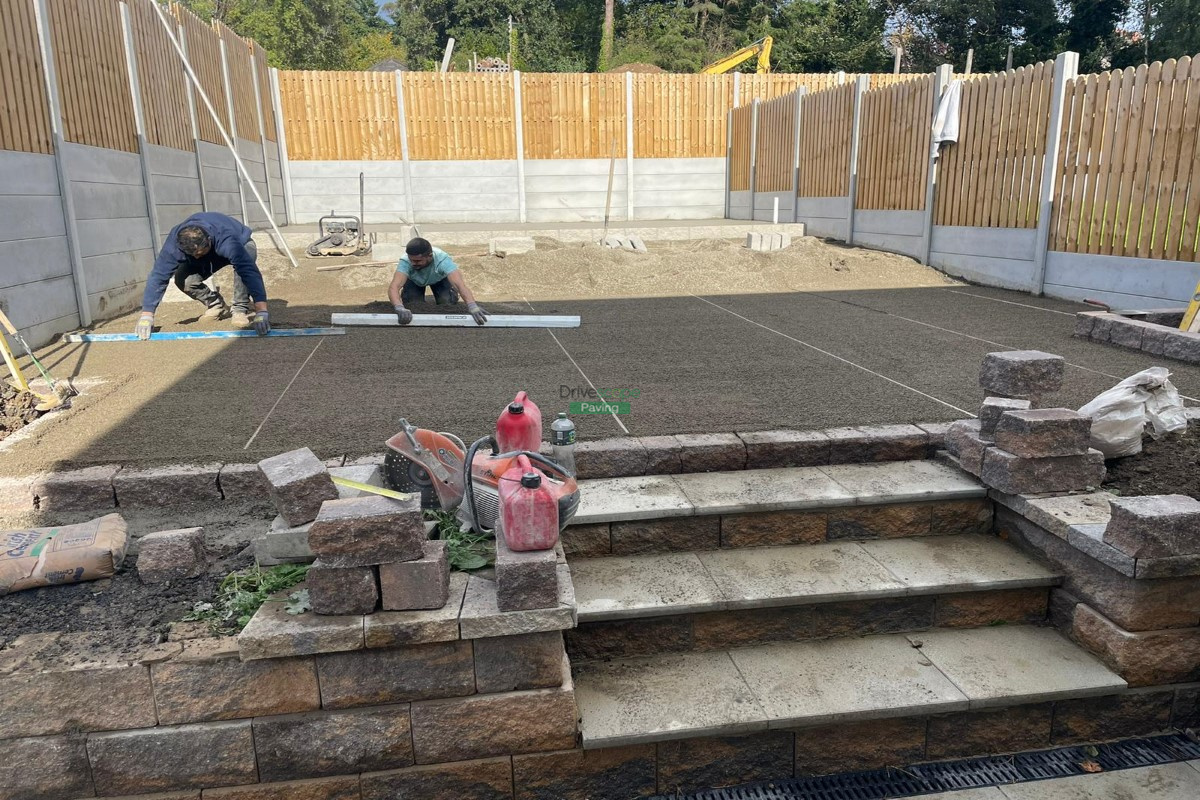 Tiered Patio with Granite Slabs, Connemara Walling and Concrete Base in