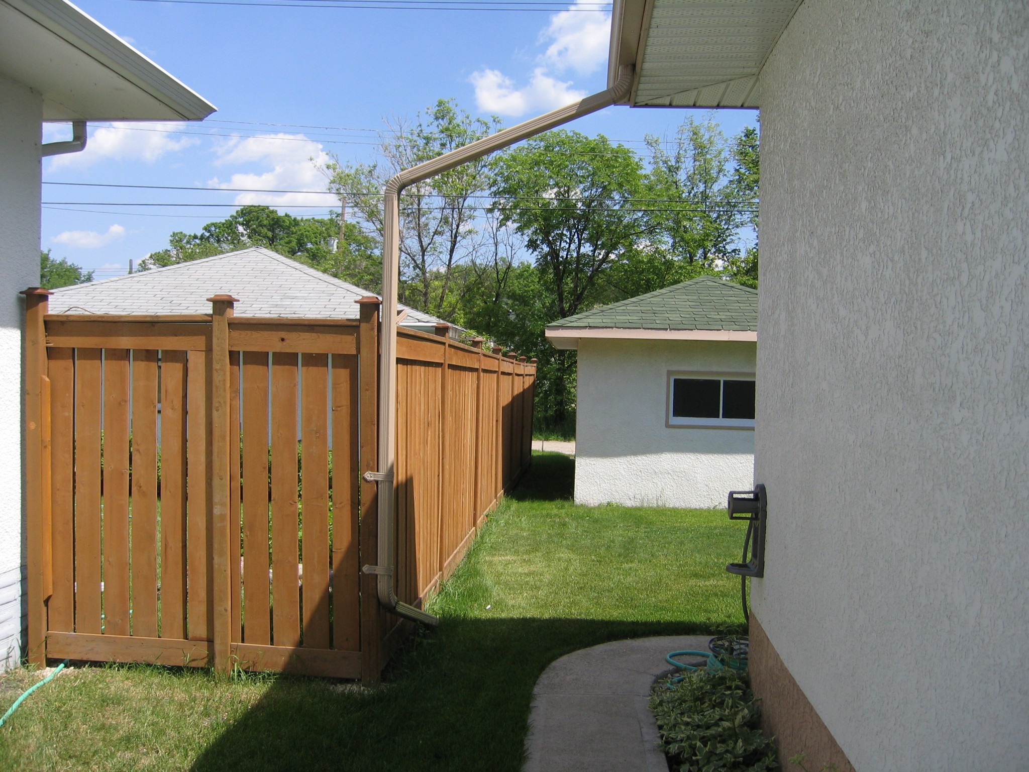 Overhead downpipe Dr. Roof Winnipeg Manitoba Canada