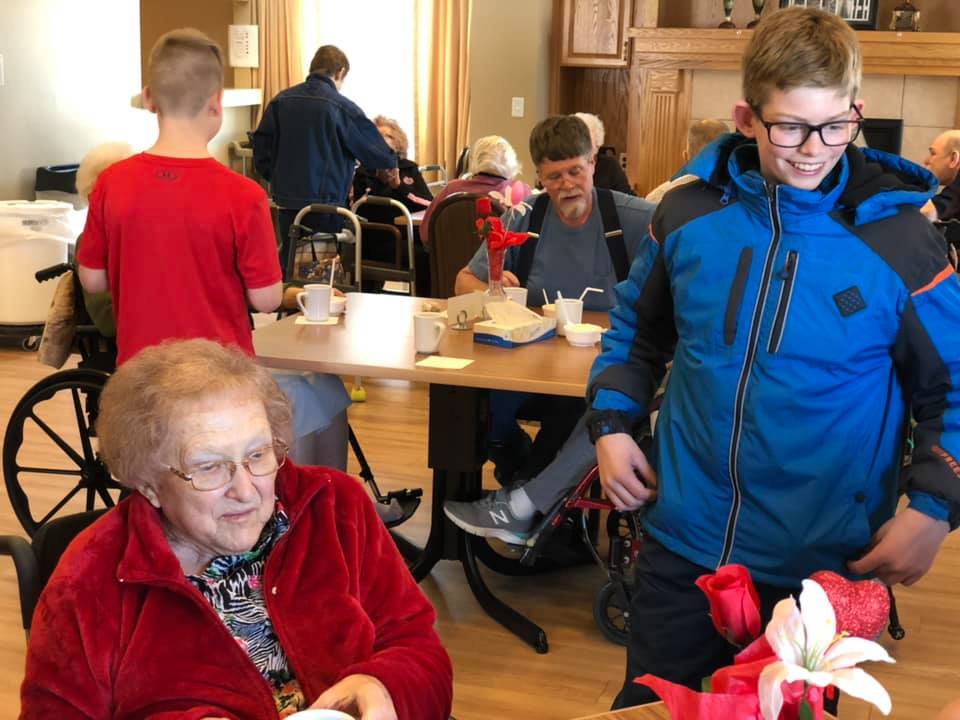 7th Grade Sewing Students Deliver Walker Caddies to Residents of