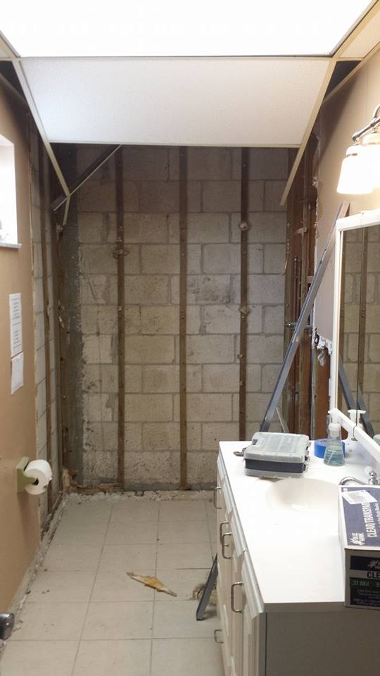 Removed over 2000 sq ft of tile, demoed 2 baths and emptied entire