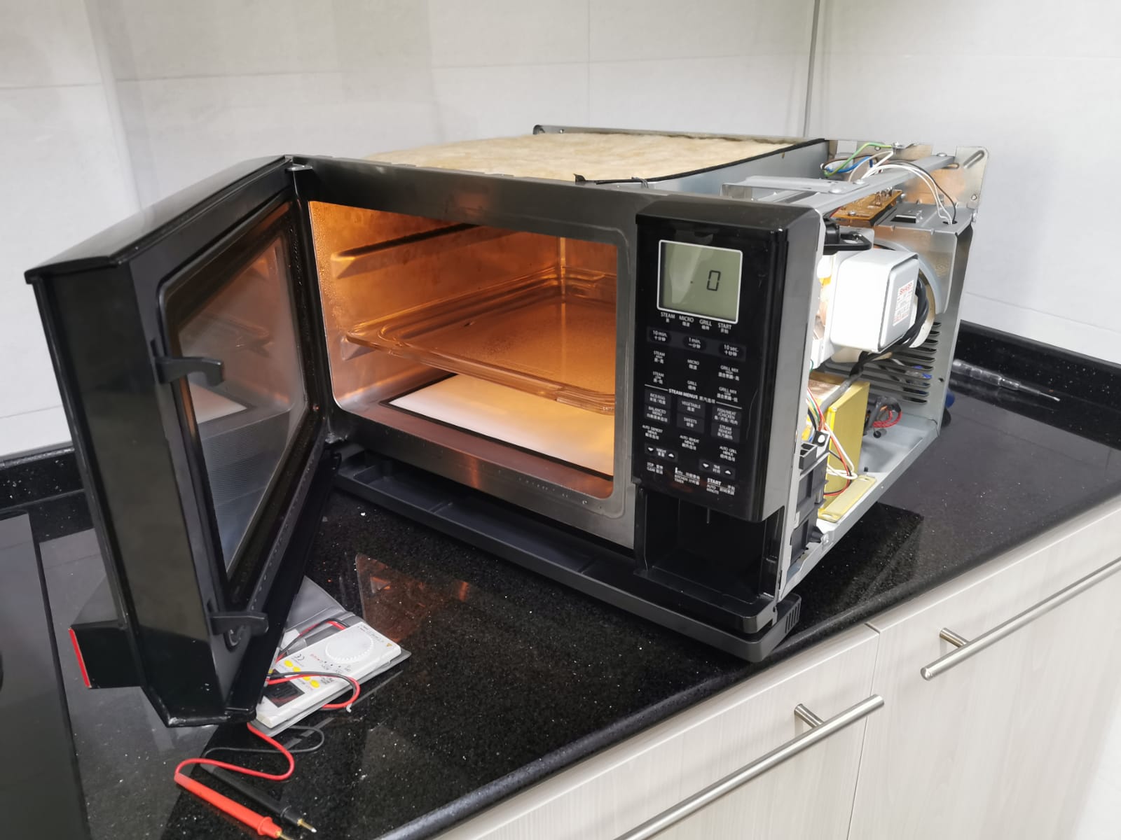 Oven Checking For Temperature Issue Reliable Electrical Services
