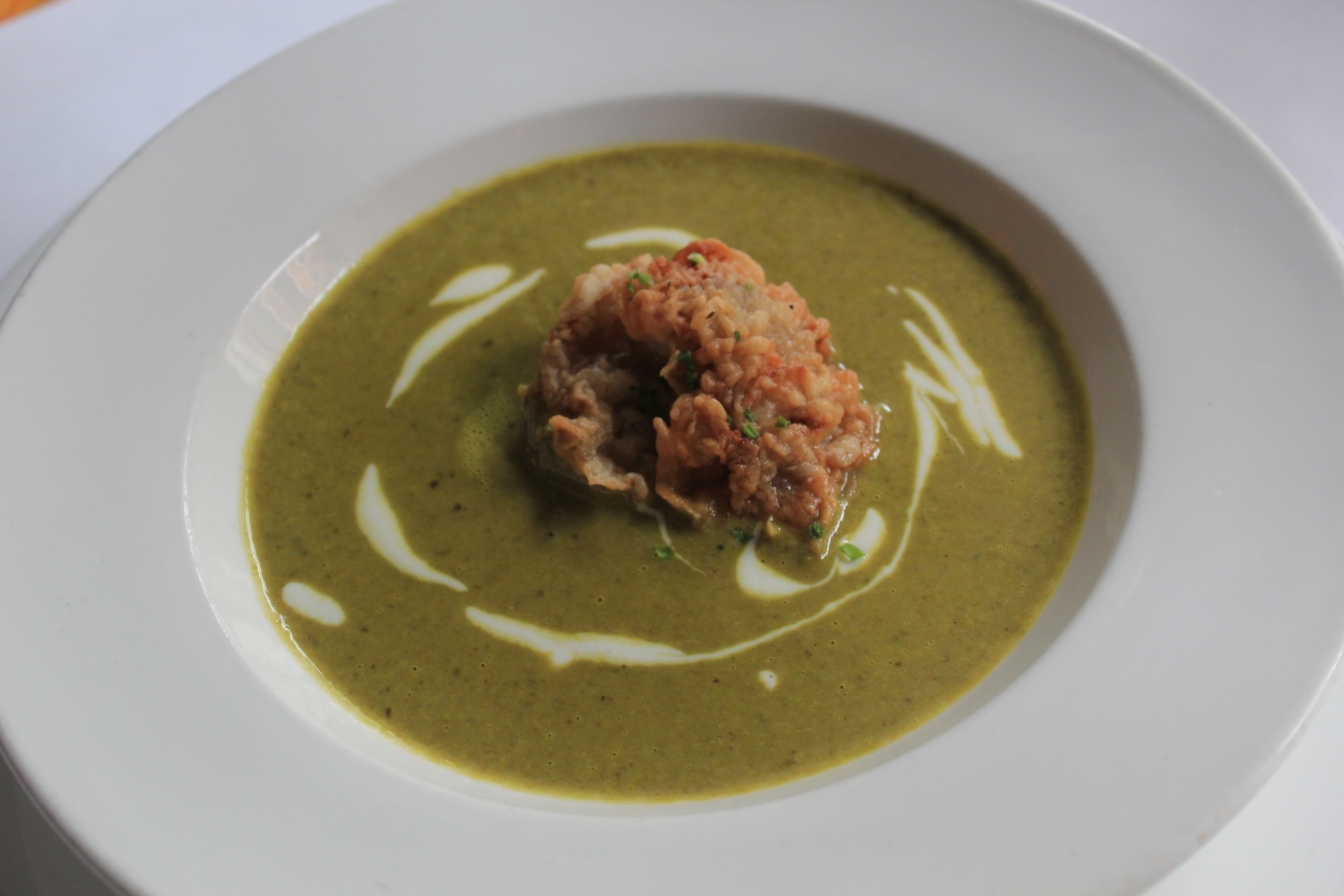 Oyster Rockefeller Soup Garnished with Crispy Bacon and Fried Oysters
