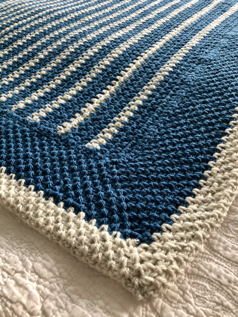 Denim and cream stripe, hand crocheted blanket. Every Stitch