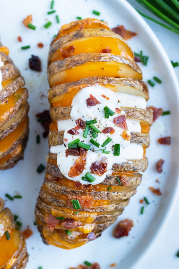 Cheesy Loaded Hasselback Potatoes with Bacon Evolving Table