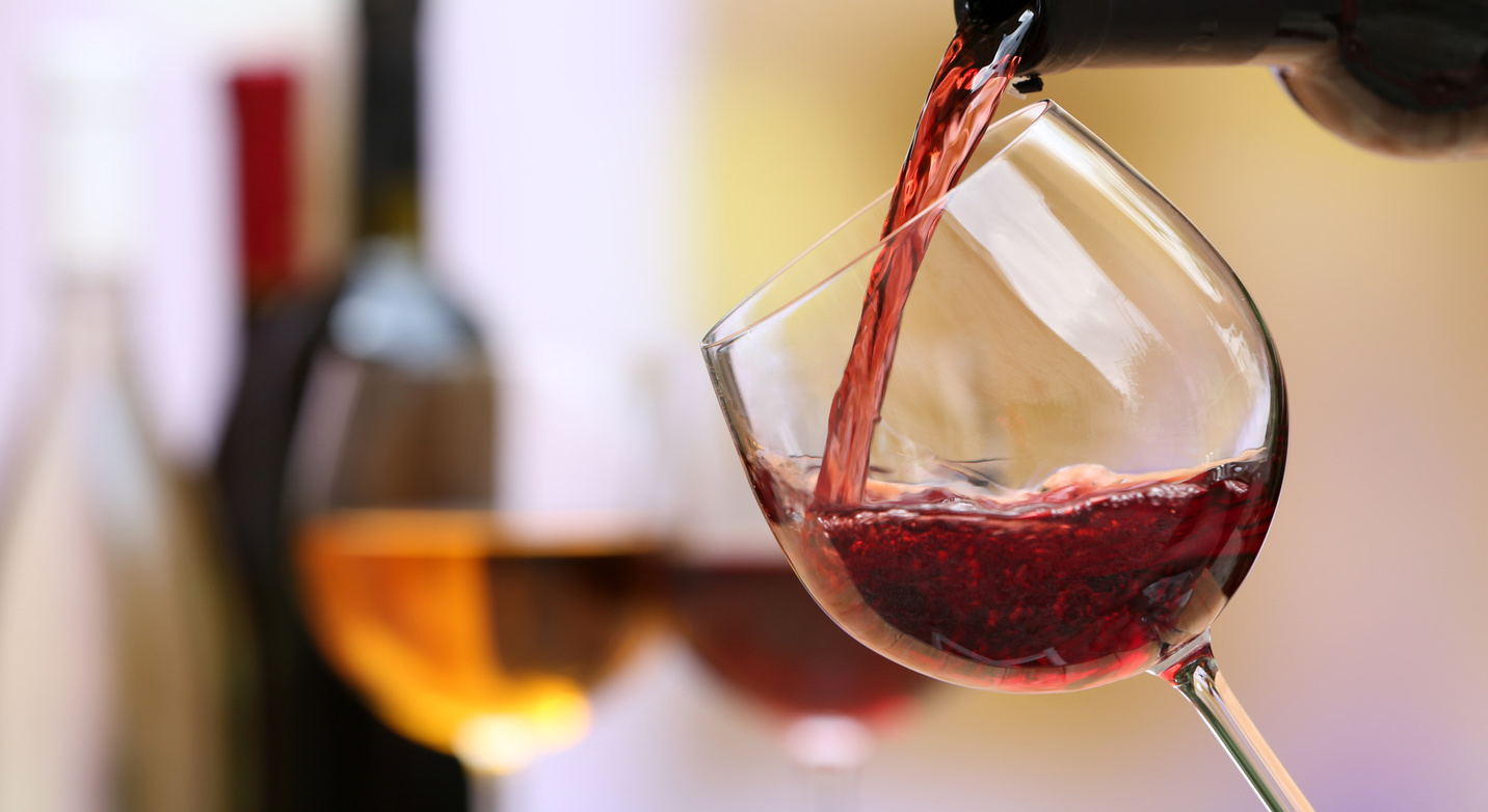 Red wine pouring into wine glass, closeup Fabbioli CellarsFabbioli