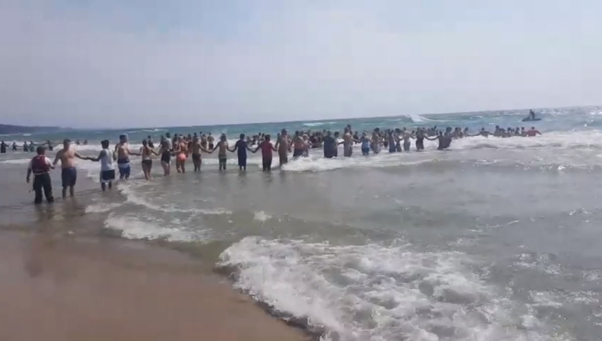 Beachgoers Form Incredible Human Chain to Save Fellow Swimmers From
