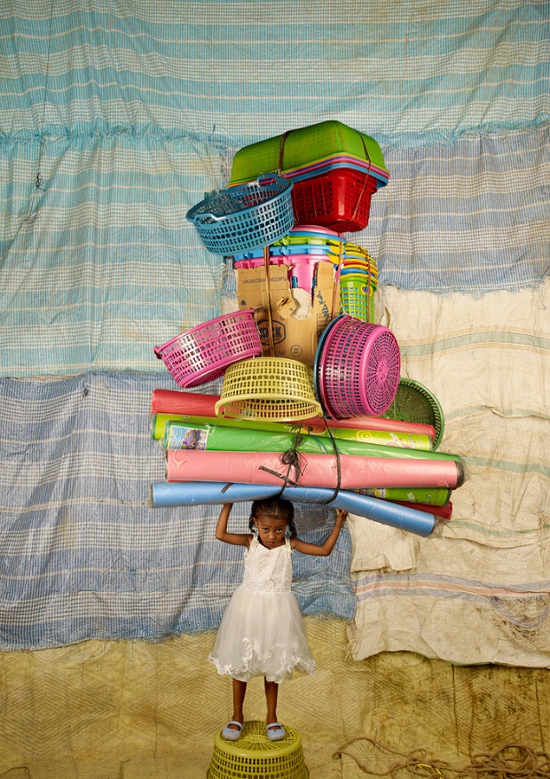 Remarkable Portraits of People Around the World Carrying Symbolic