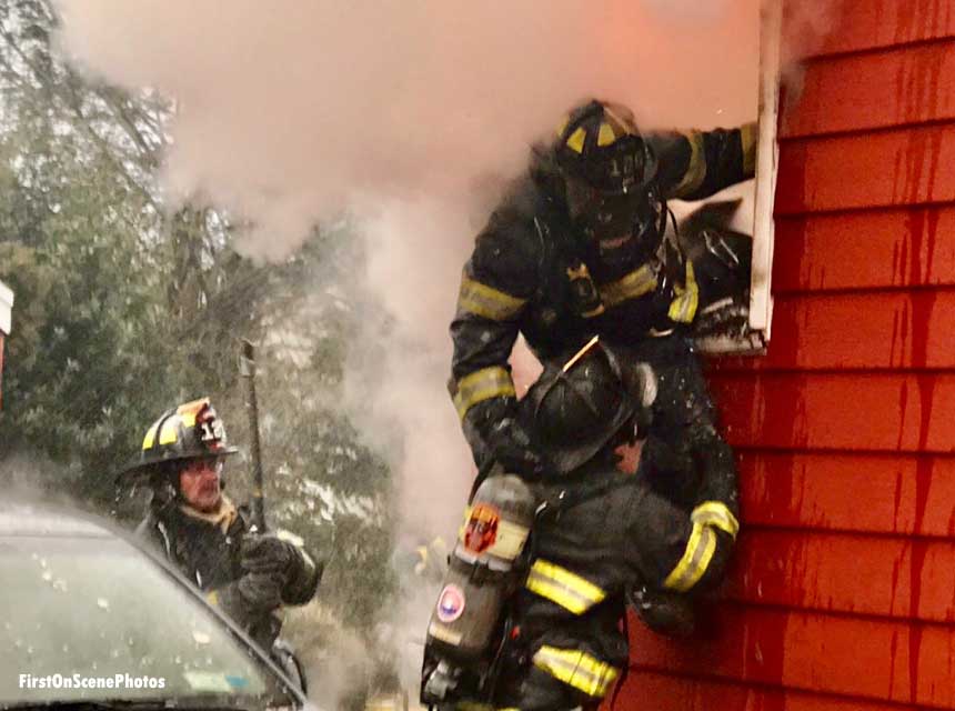 Photos Firefighter Escapes from Window at Floral Park (NY) House Fire