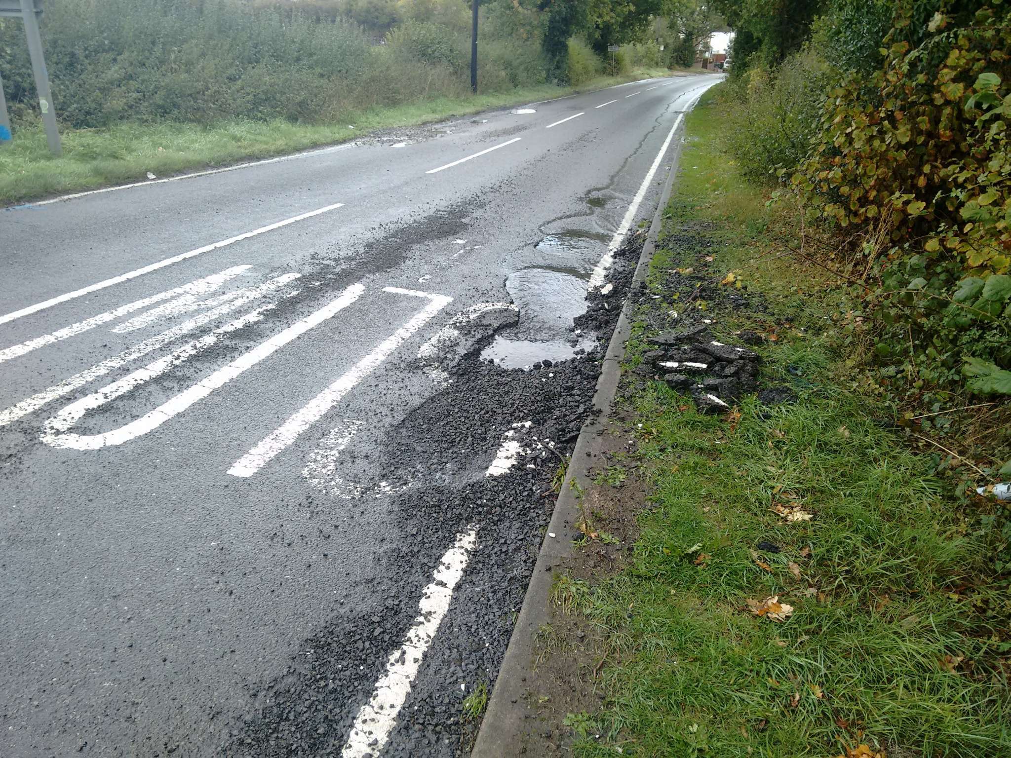Water leak eroding road Viewing a problem FixMyStreet