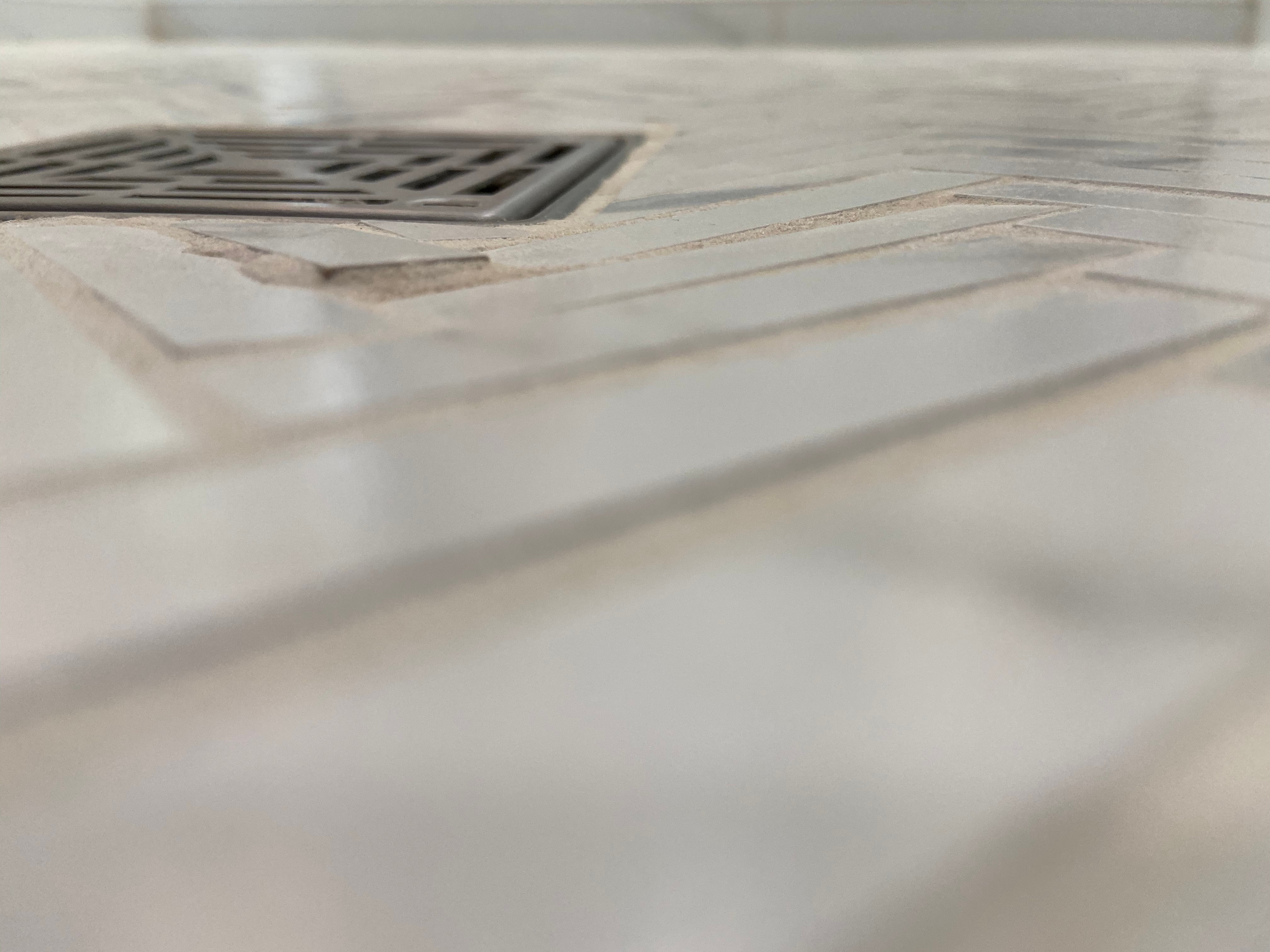 Sheetrock and glue/ bathroom tile Flooring Inspectors