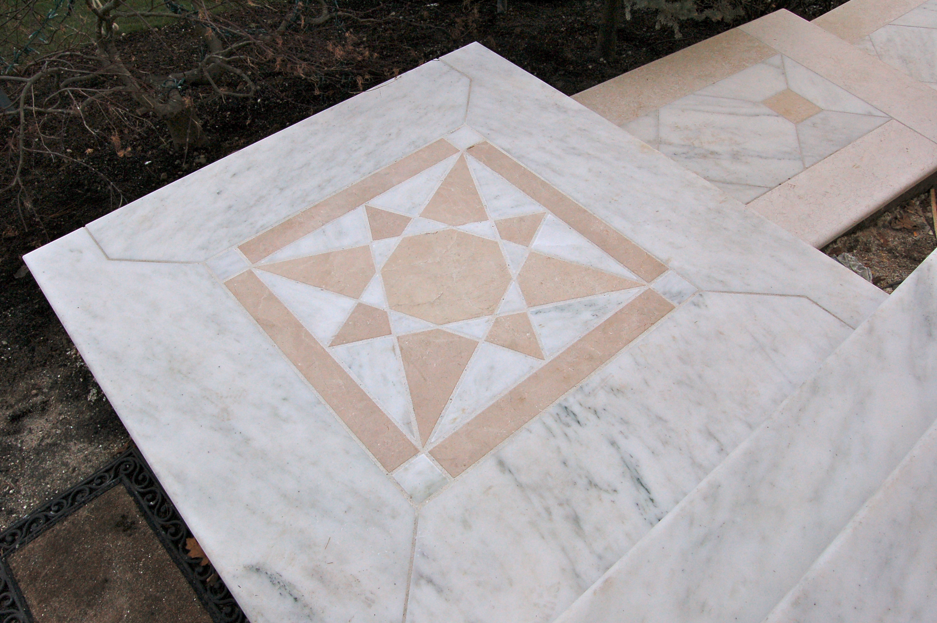 Marble landing with inlay design stone mason in Salem, Ma.