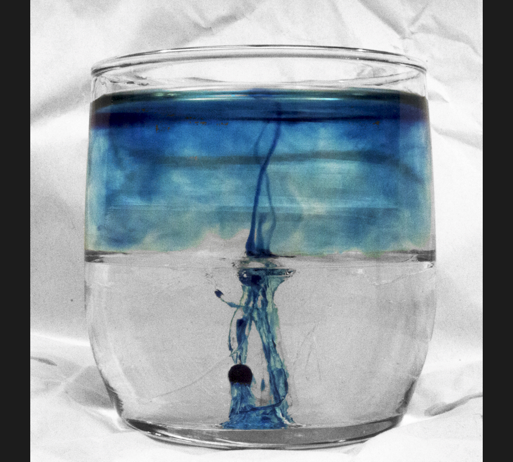 Dyed rubbing alcohol creeps upward through corn syrup, then mixes more