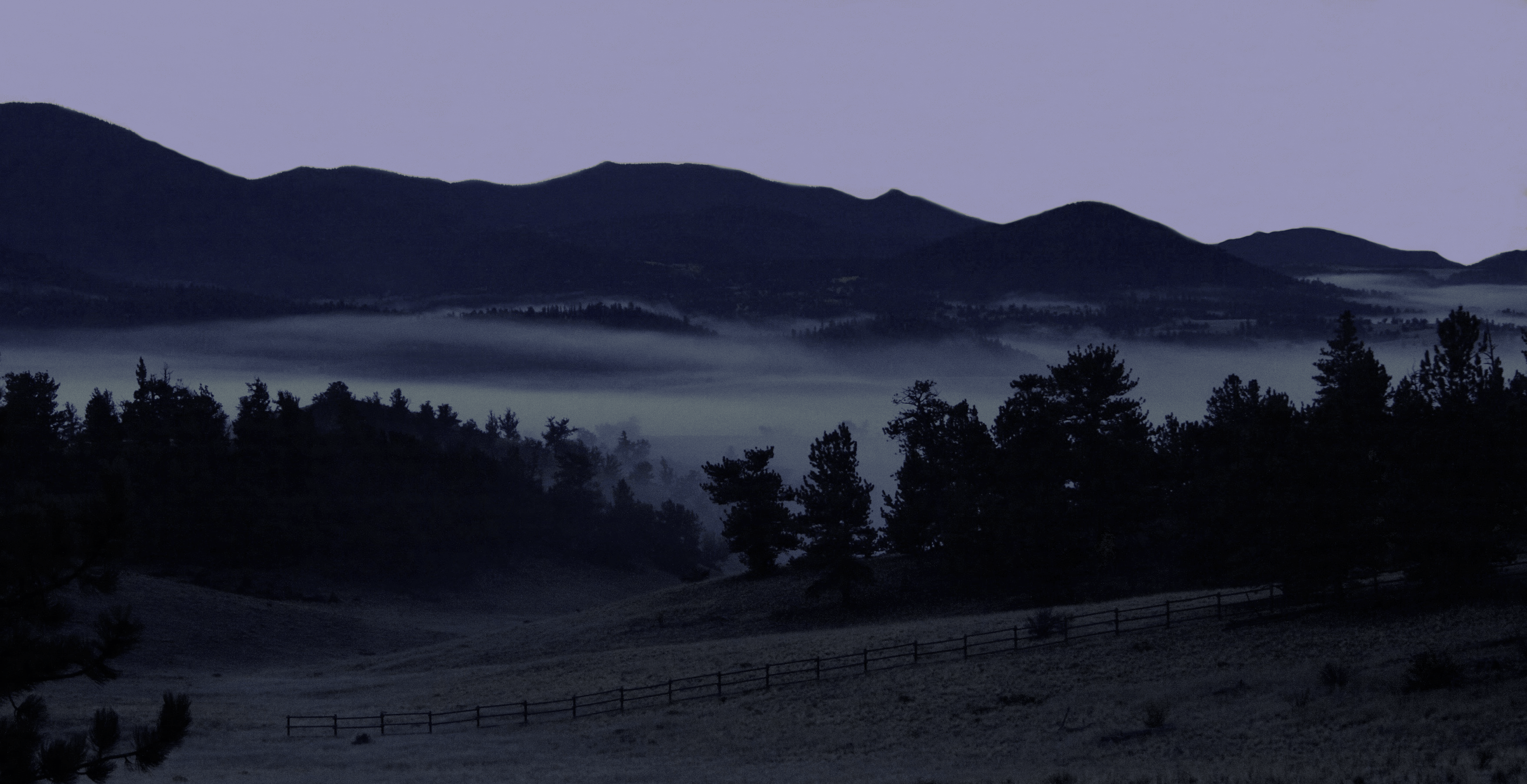 Fog (stratus) clouds in an unstable atmosphere before sunrise in the