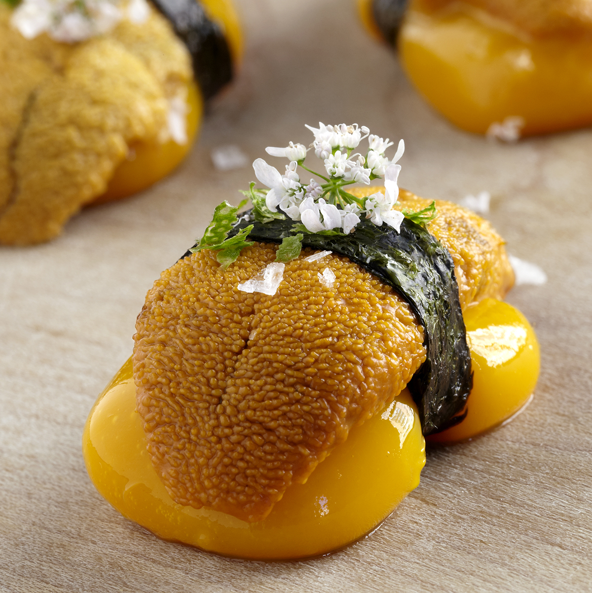 Liquid mango nigiri sea urchin, shiso & pickled sansho pepper FOUR