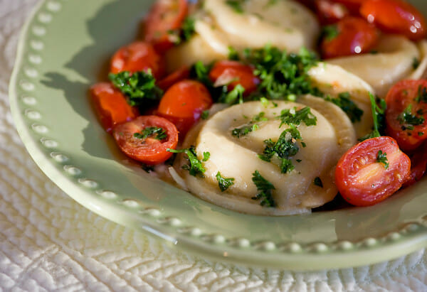 ravioli with tomatoes in white wine sauce