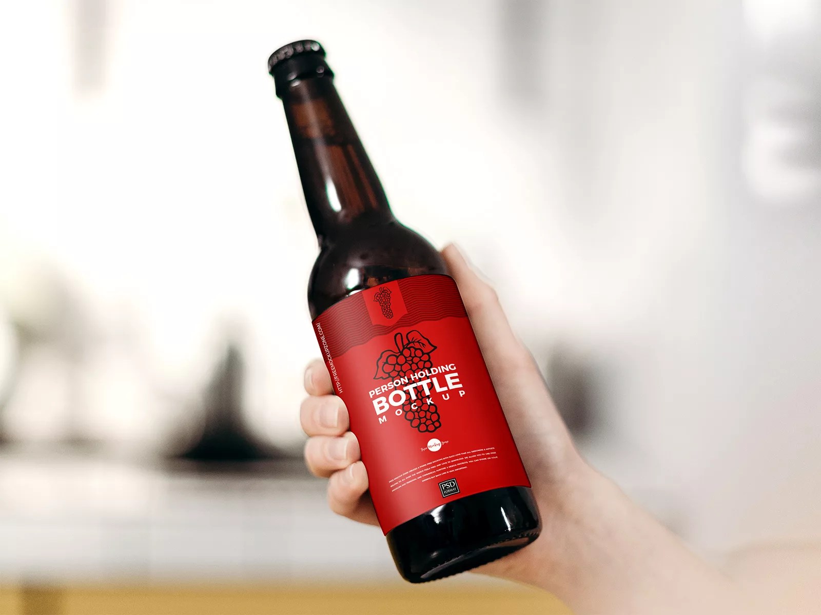 Free Beer Bottle Mockup in Hand Free Mockup