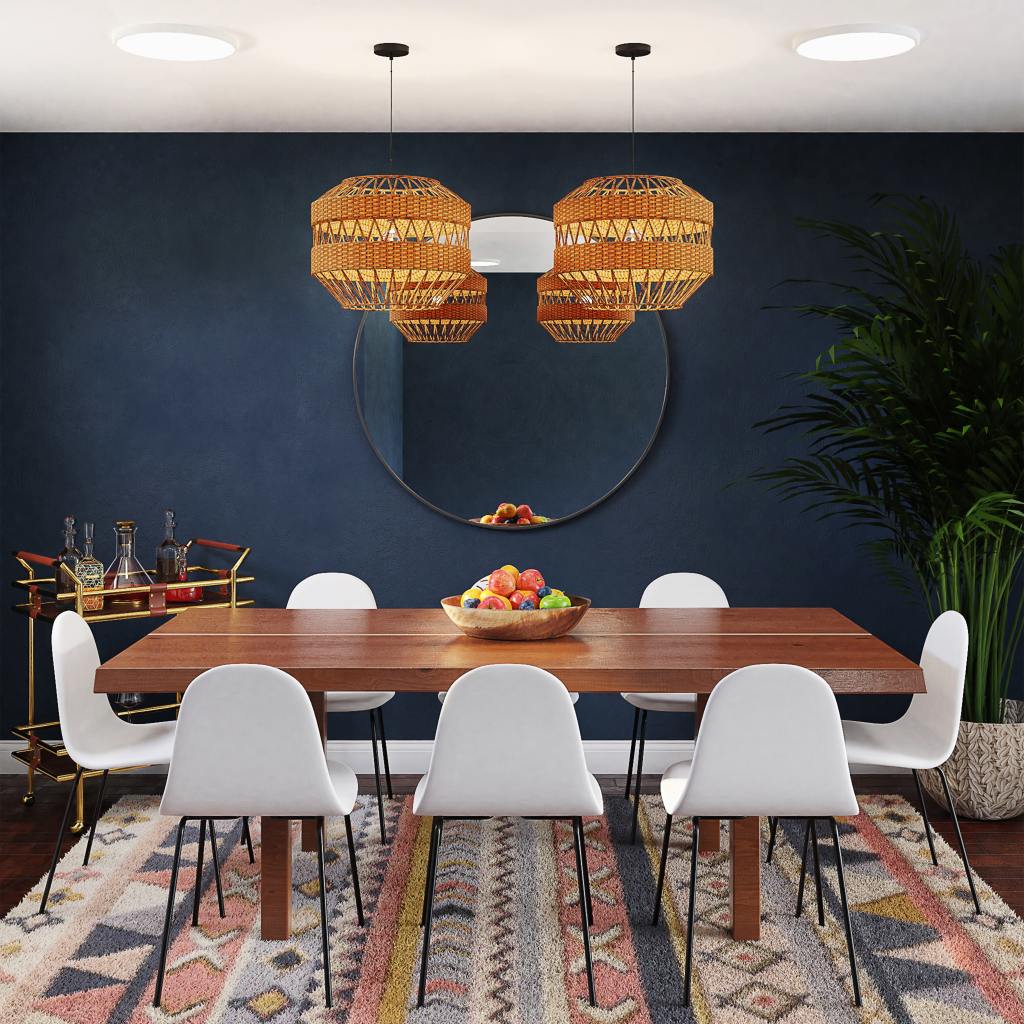 Nicely defined dining area with a rug underneath the table