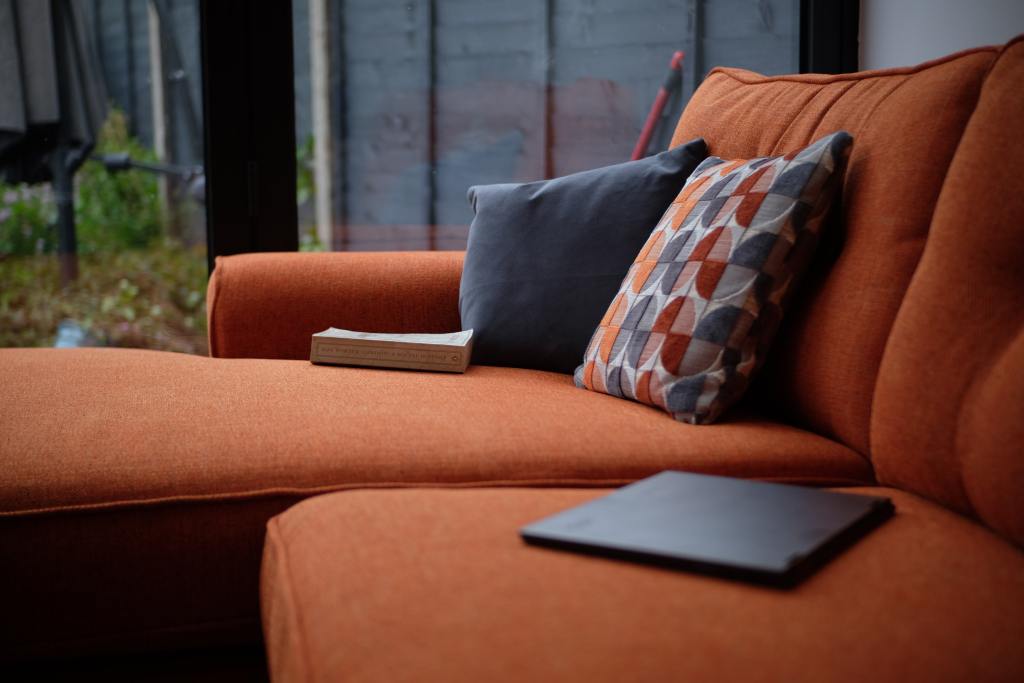 Cosy sofa in a warm terracotta colour