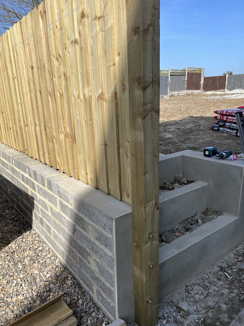 Fencing on Top of Brick Wall